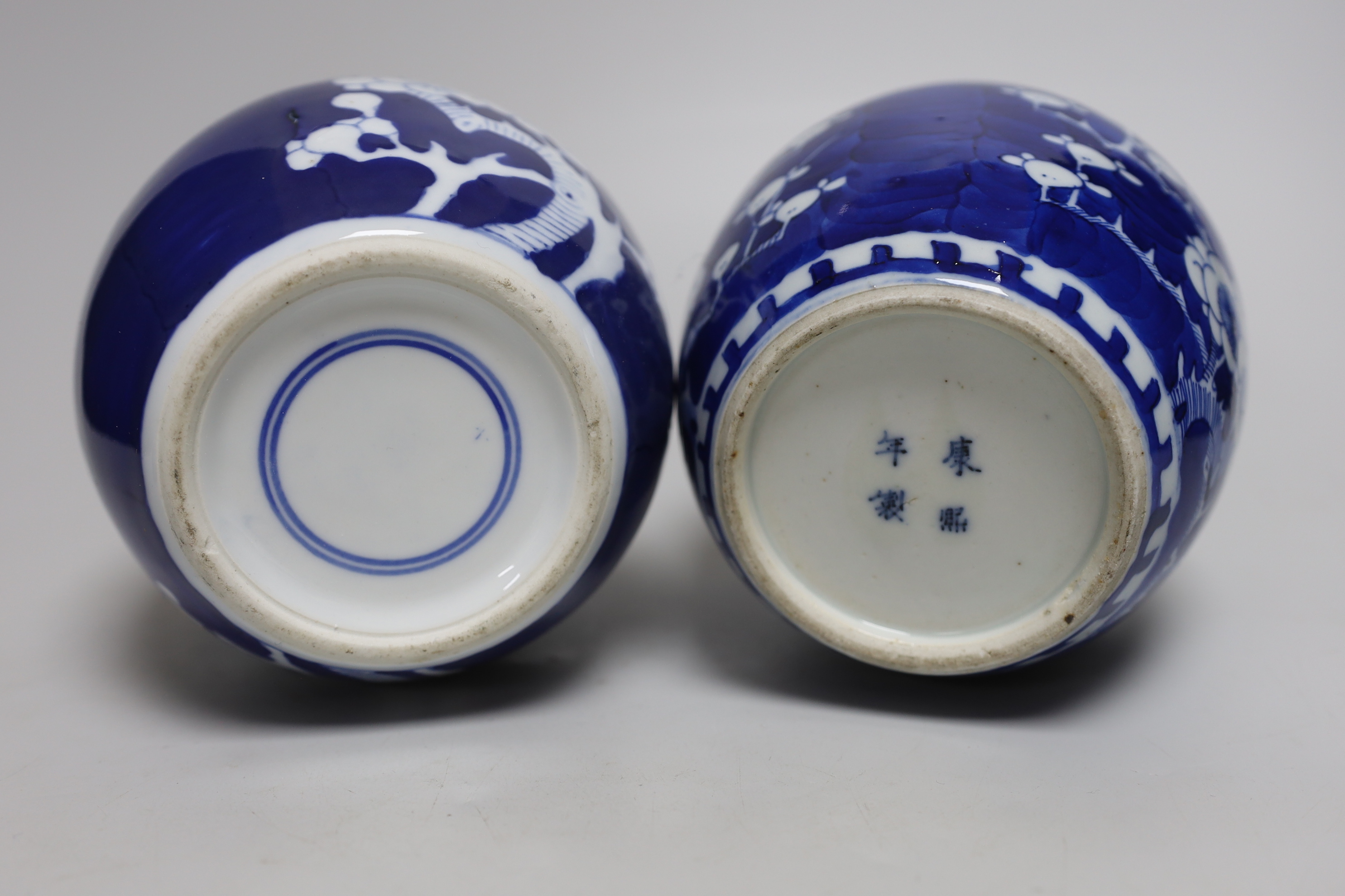 Five Chinese blue and white prunus ginger jars, one with cover- 15cm high and another jar